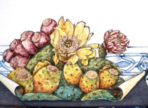 Particolare di un tavolo in pietra lavica con fiori e frutti di fichi d'India